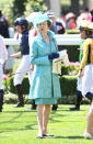 <p>Princess Anne is folloowing in her mother’s footsteps by wearing stand-out designs to Ascot. Here she’s pictured in a baby blue outfit, with she matched with a feathered hat. Photo: Getty Images </p>