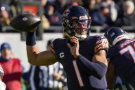 Chicago Bears' Justin Fields thorws during the first half of an NFL football game against the Green Bay Packers Sunday, Dec. 4, 2022, in Chicago. (AP Photo/Nam Y. Huh)