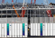 Logos of Japanese construction company Taisei Corporation are seen at a gate of the construction site of New National Stadium for the Tokyo 2020 Olympics and Paralympics in Tokyo, Japan December 22, 2017. REUTERS/Issei Kato