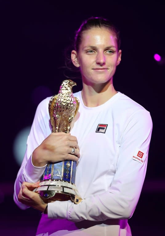 Karolina Pliskova of the Czech Republic poses with the winner's trophy at the WTA Qatar Total Open on February 18, 2017, in Doha