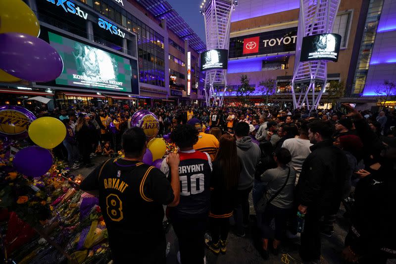 Fans of NBA basketball star Kobe Bryant pay their respects at a memorial outside the Staples Center at L.A. Live in Los Angeles