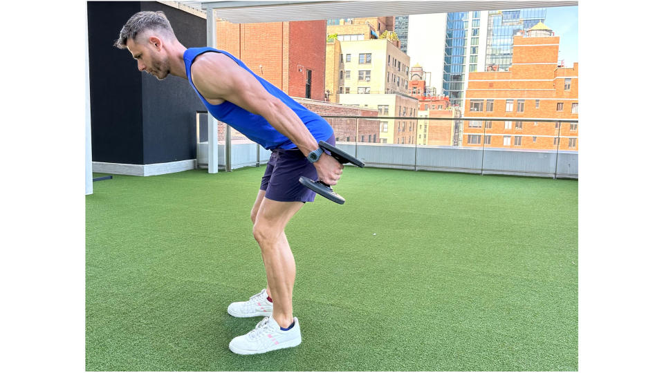 Andy Speer performing a dumbbell swing