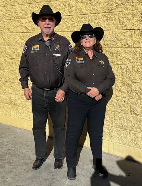 PHOTO: Liz Rizzo poses for a photo with her husband, Richard, in their AJ Mounted Rangers uniforms. Rizzo was wearing her uniform the day she met Carman Kelly. (Courtesy of Liz Rizzo)