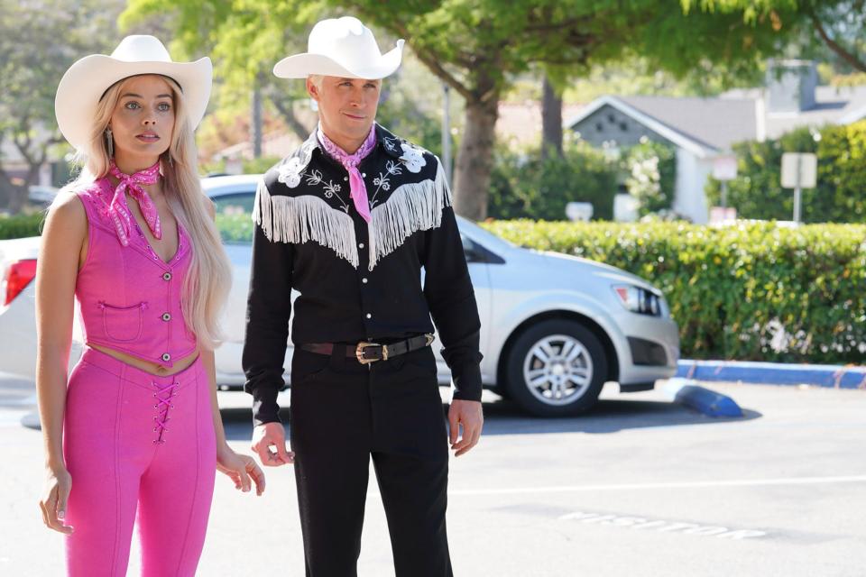 Barbie (Margot Robbie, left) and Ken (Ryan Gosling) ditch their roller skates for rodeo attire when they arrive in Los Angeles.