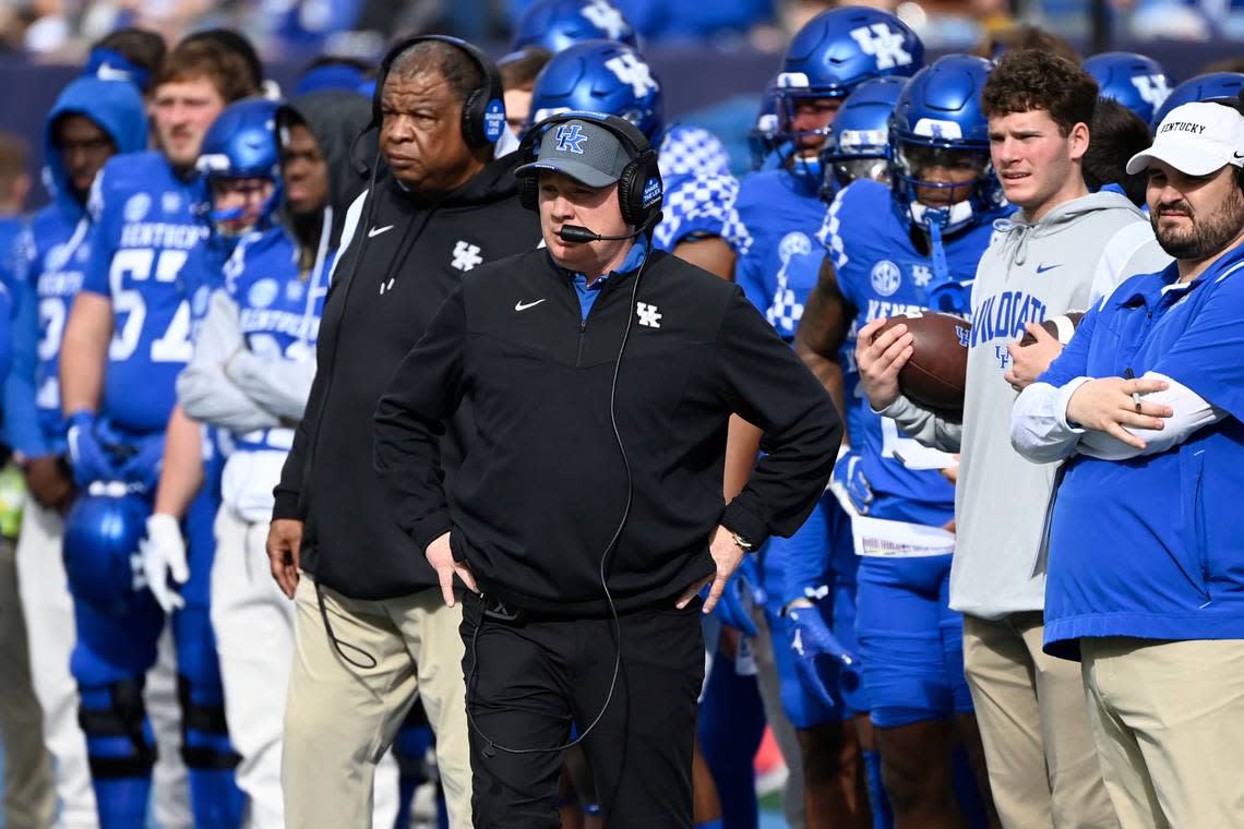 Kentucky head coach Mark Stoops, center, watches his players in the first half of the Music City Bowl NCAA college football game against Iowa, Saturday, Dec. 31, 2022, in Nashville, Tenn. (AP Photo/Mark Zaleski)