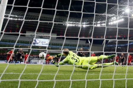 Football Soccer - Bayer Leverkusen v RB Leipzig - German Bundesliga - BayArena , Leverkusen, 18/11/16 Leverkusen's Hakan Calhanoglu fails to score with a penalty against Leipzig's goalkeeper Peter Gulacsi. REUTERS/Wolfgang Rattay