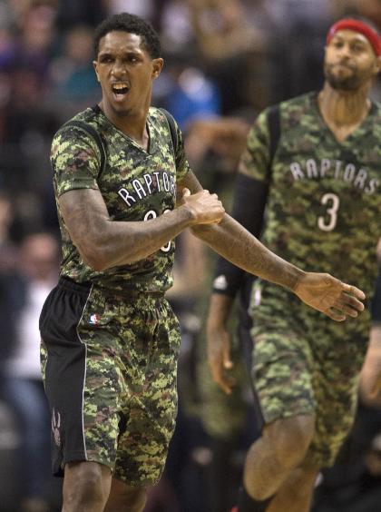 Toronto Raptors&#39; Lou Williams celebrates a 3-pointer against the Orlando Magic during the second half of an NBA basketball game Tuesday, Nov. 11, 2014, in Toronto. (AP Photo/The Canadian Press, Frank Gunn)
