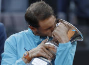 Rafael Nadal of Spain kisses his trophy after winning against Novak Djokovic of Serbia at the end of their final match at the Italian Open tennis tournament, in Rome, Sunday, May 19, 2019. (AP Photo/Gregorio Borgia)