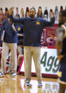 Michigan head coach Juwan Howard reacts to a call by the game officials during the first half of an NCAA college basketball game against Indiana, Saturday, Feb. 27, 2021, in Bloomington, Ind. (AP Photo/Doug McSchooler)