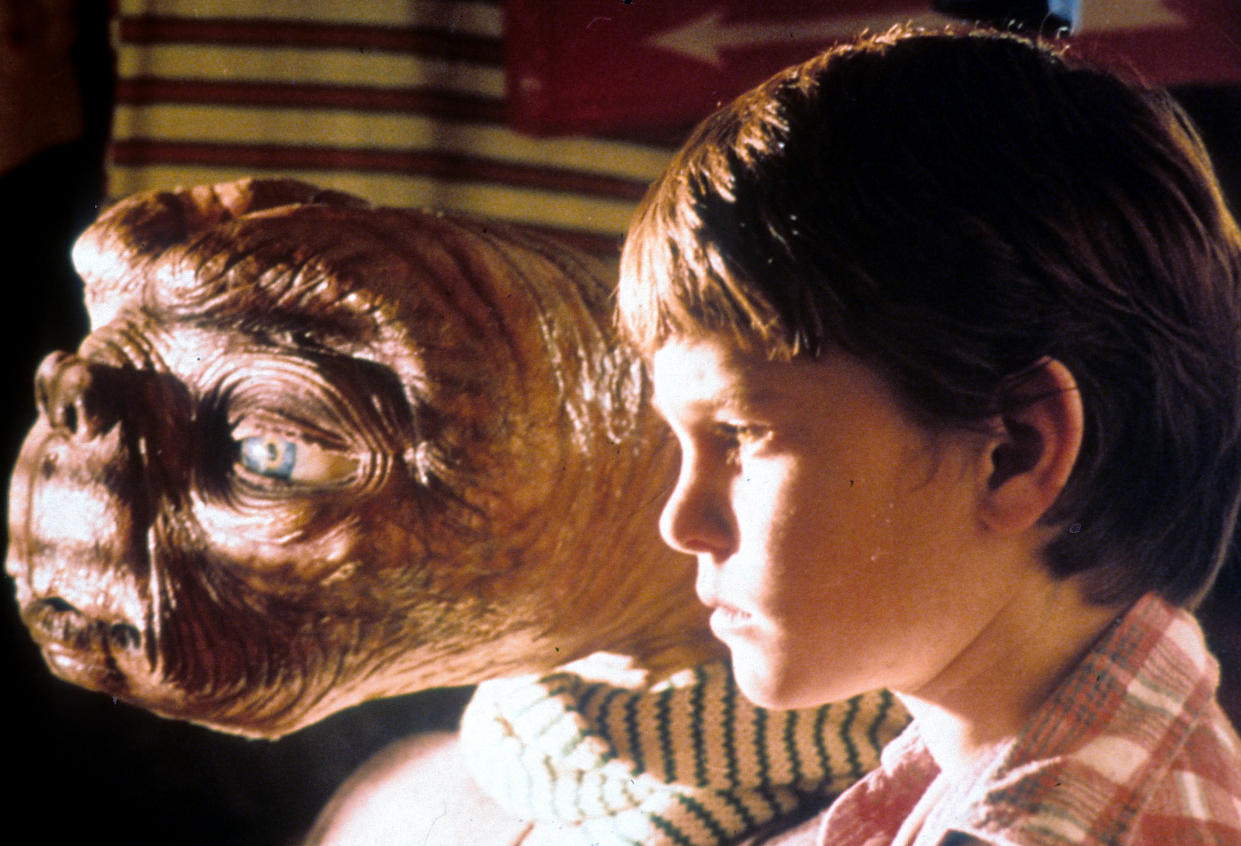 ET looking out window with Henry Thomas in a scene from the film 'E.T. The Extra-Terrestrial', 1982. (Photo by Universal/Getty Images)