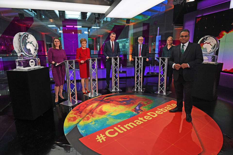 RETRANSMITTED WITH CORRECT CAPTION Krishnan Guru-Murthy (foreground) with (rear left to right) Liberal Democrat leader Jo Swinson, SNP leader Nicola Sturgeon, Plaid Cymru leader Adam Price, Labour Party leader Jeremy Corbyn and Green Party Co-Leader Sian Berry, standing next to ice sculptures representing the Brexit Party and Conservative Party who didn't appear at the event, before the start of the Channel 4 News' General Election climate debate at ITN Studios in Holborn, central London.