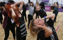 Dancers rehearse at the London 2012 Olympics beach volleyball venue in central London July 19, 2012. (REUTERS/Suzanne Plunkett)