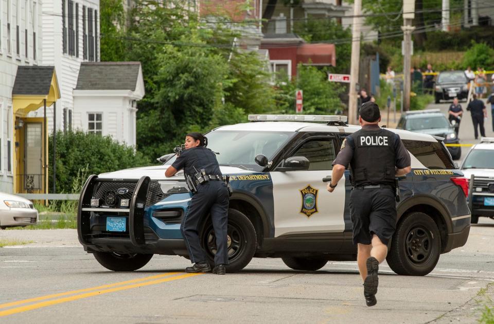 Fitchburg police officers surround 40 Oliver St. during an armed standoff with a man inside Tuesday.