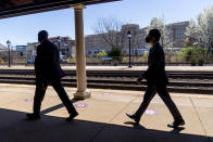 FILE - In this March 30, 2021, file photo Transportation Secretary Pete Buttigieg, right, departs a news conference to announce the expansion of commuter rail in Virginia at the Amtrak and Virginia Railway Express (VRE) Alexandria Station in Alexandria, Va. (AP Photo/Andrew Harnik, File)