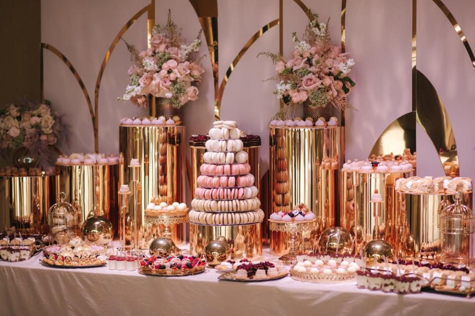 wedding dessert bar in gold and pink