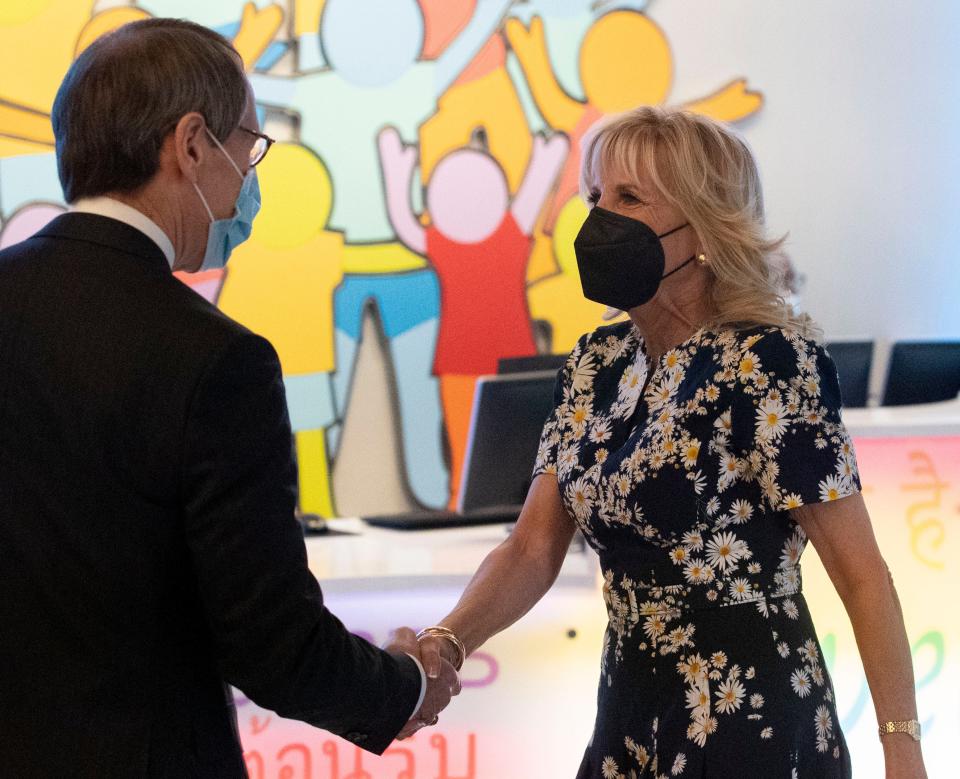 First Lady Jill Biden Friday shakes hands with President and CEO of St. Jude James Downing on March 25, 2022, at St. Jude Children's Research Hospital in Memphis. Biden visited the hospital to promote the White House's Cancer Moonshot initiative. The initiative aims to half the number of cancer deaths in the next 25 years.