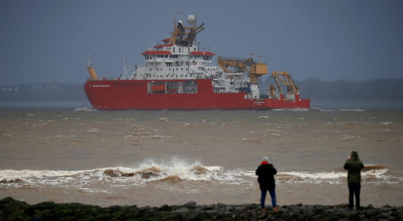 People watch as the RSS Sir David Attenborough leaves Liverpool to begin sea trials in New Brighton, Britain