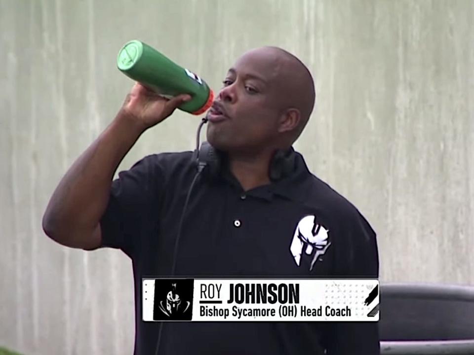 A screenshot shows former Bishop Sycamore football head coach Roy Johnson drinking water.