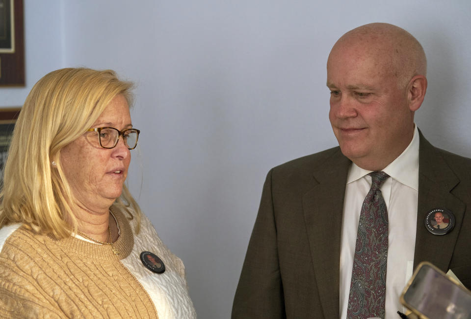 Kim Clinkunbroomer, left, and Mike Clinkunbroomer, the parents of late Los Angeles Sheriff's Deputy Ryan Clinkunbroomer, talk to the media after announcing the precursor of a lawsuit against the Sheriff's Department at a news conference in Los Angeles on Tuesday, Nov. 28, 2023. Los Angeles County Sheriff's Deputy Clinkunbroomer was shot and killed Sept. 16, while sitting in his patrol car in Palmdale, Calif. His parents are seeking justice for their son and looking to make a change in LACSD's policies to protect other deputies from death. (AP Photo/Damian Dovarganes)