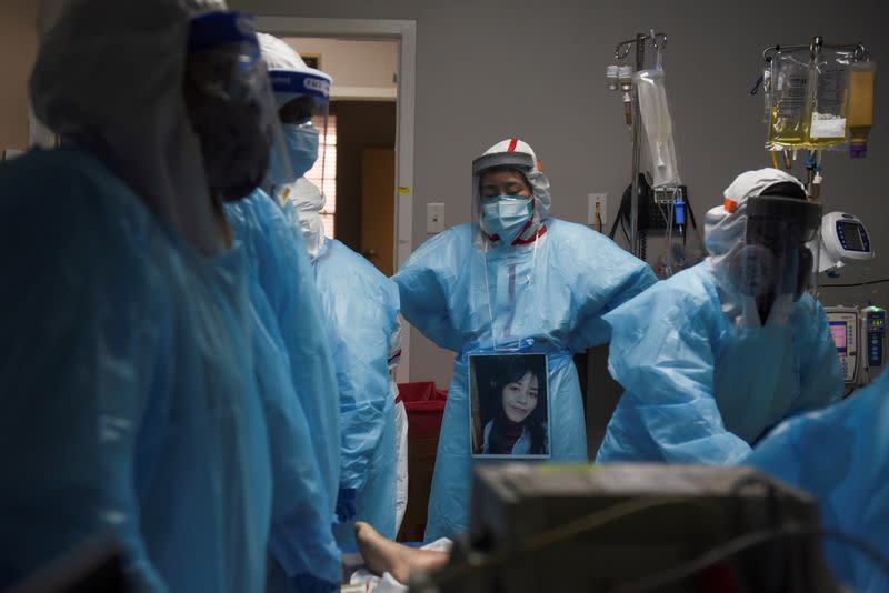 FILE PHOTO: Healthcare personnel work inside a COVID-19 unit in Houston