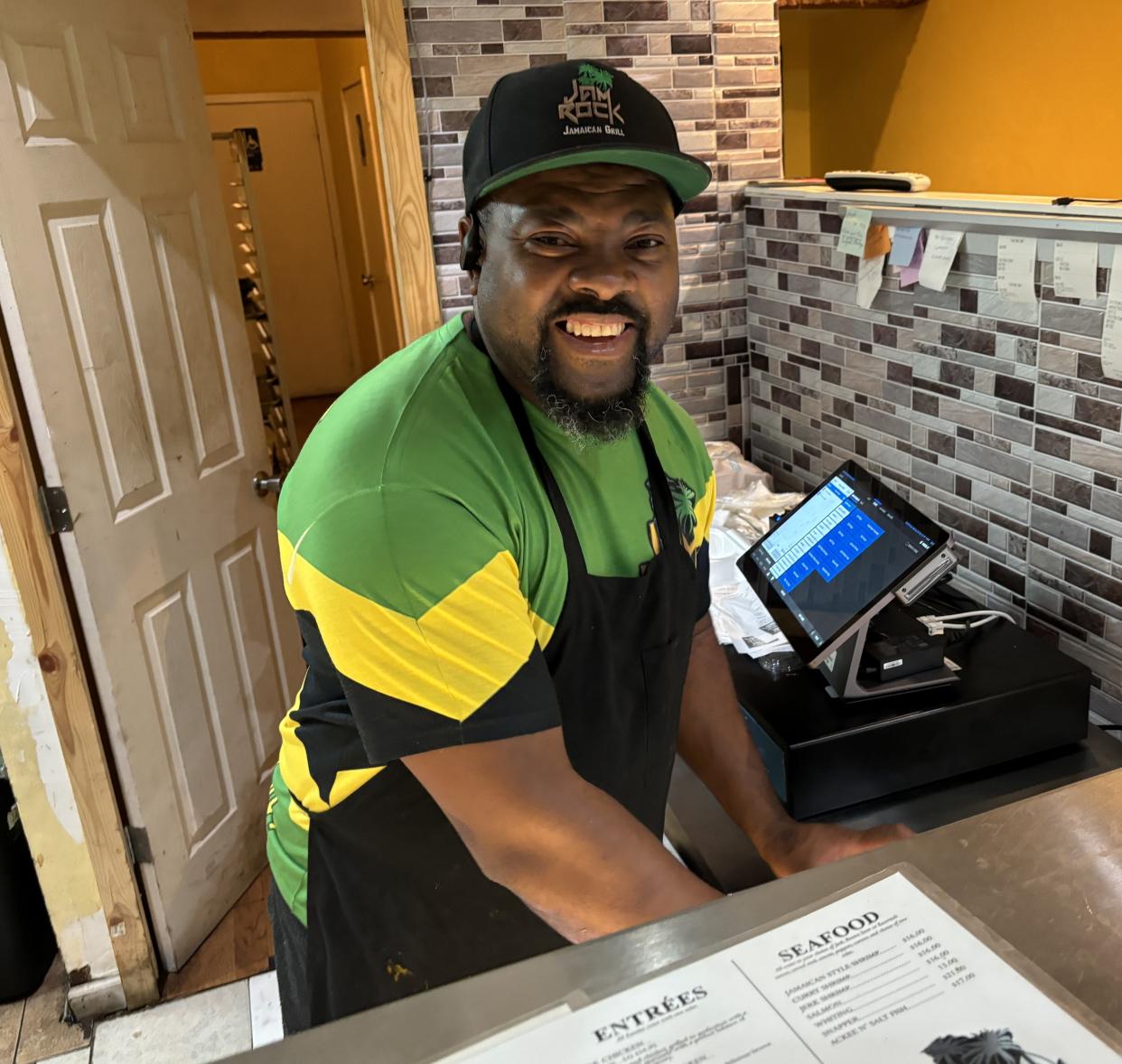 Restaurateur Niguel Wood serves authentic Jamaican fare at Jamrock Sports Bar & Grill at 417 College Road in Wilmington, N.C.