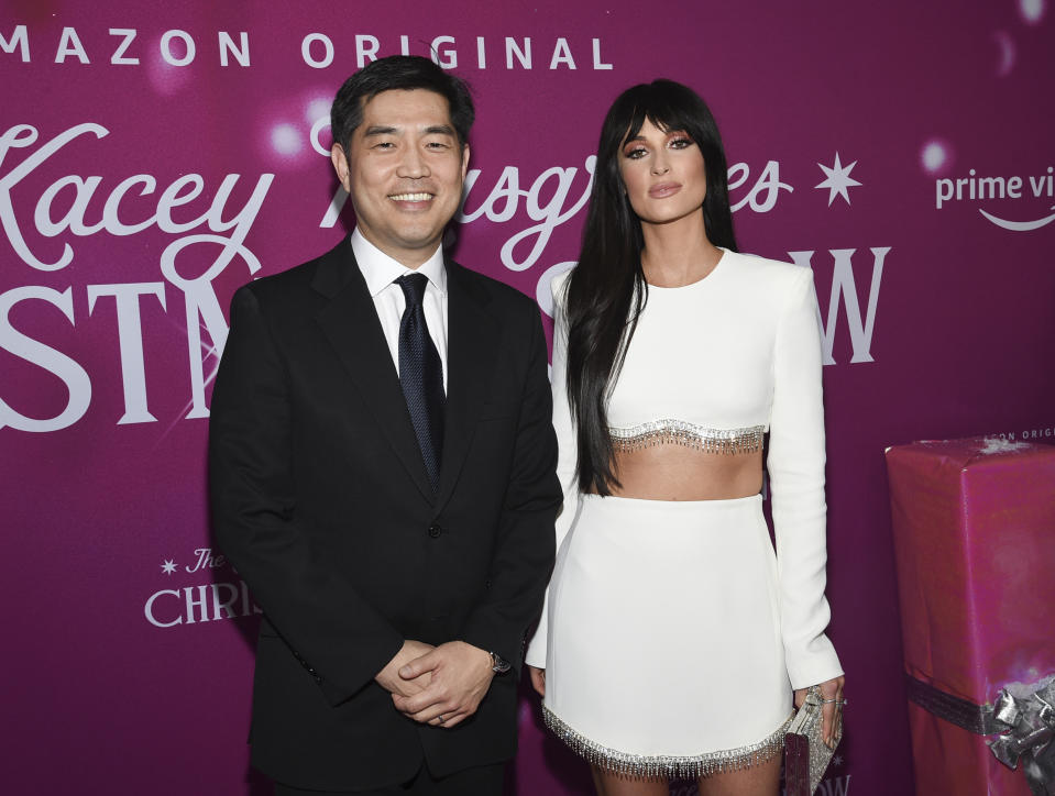 Amazon Studios COO Albert Cheng, left, and singer-songwriter Kacey Musgraves attend the premiere of Amazon Prime Video's "The Kacey Musgraves Christmas Show," at Metrograph, Tuesday, Nov. 19, 2019, in New York. (Photo by Evan Agostini/Invision/AP)