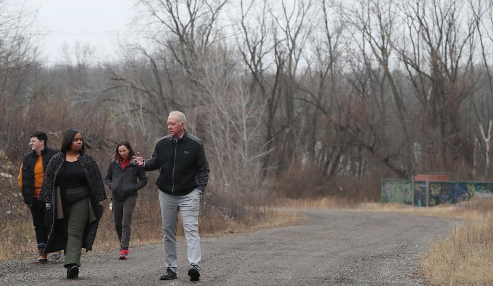 Akron City Council President Margo Sommerville and Akron Mayor Dan Horrigan talk about the White Pond development property as they toured the city owned site on Tuesday in Akron.