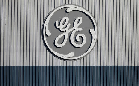 FILE PHOTO: The logo of U.S. conglomerate General Electric is pictured at the company's site of its energy branch in Belfort, France, February 5, 2019. REUTERS/Vincent Kessler