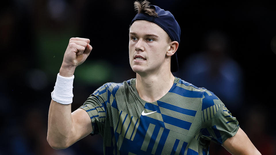 Holger Rune celebrates winning a point over Novak Djokovic during the Paris Masters final.