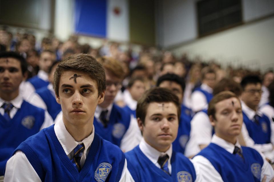 Students attend an Ash Wednesday Mass at Santa Margarita Catholic High School on Wednesday, March 5, 2014, in Rancho Santa Margarita, Calif. Ash Wednesday marks the beginning of Lent, a time when Christians commit to acts of penitence and prayer in preparation for Easter Sunday. (AP Photo/Jae C. Hong)