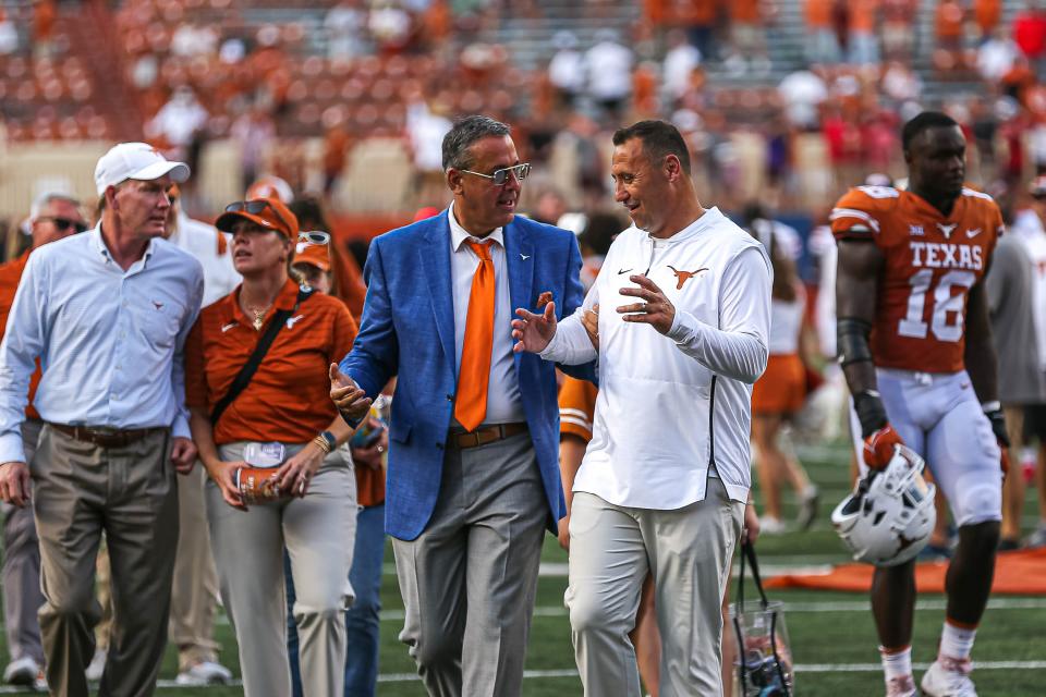 Texas athletic director Chris Del Conte, left, said he plans to discuss a possible contract extension and raise for head football coach Steve Sarkisian, right, in the next few weeks. Sarkisian has three years left on his contract and is the country's 30th highest-paid coach.