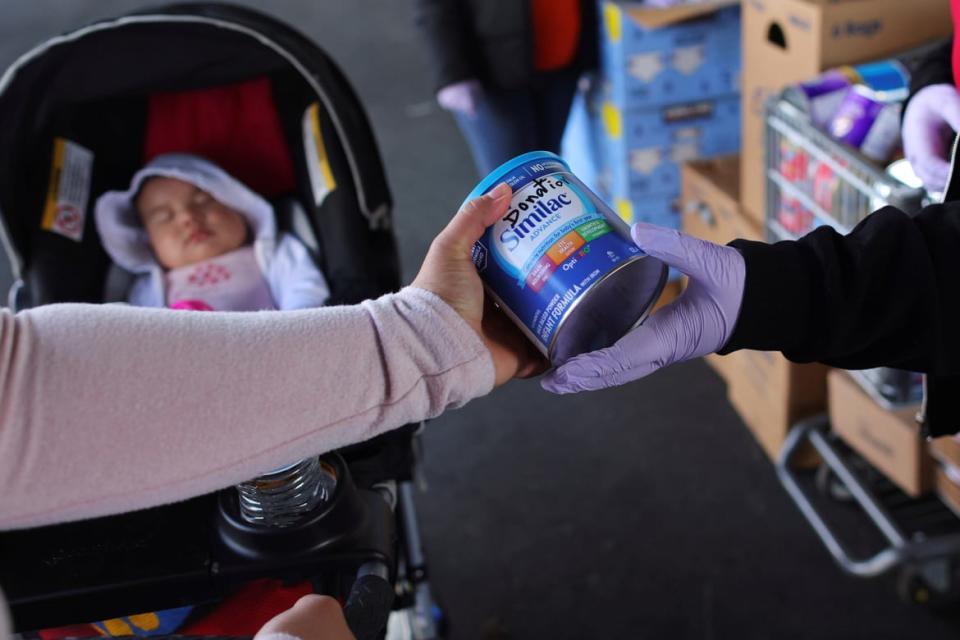 <div class="inline-image__caption"><p>A mother receives free baby formula, amid continuing nationwide shortages in infant and toddler formula, at a food pantry run by La Colaborativa in Chelsea, Massachusetts on May 18, 2022.</p></div> <div class="inline-image__credit">Brian Snyder/Reuters</div>