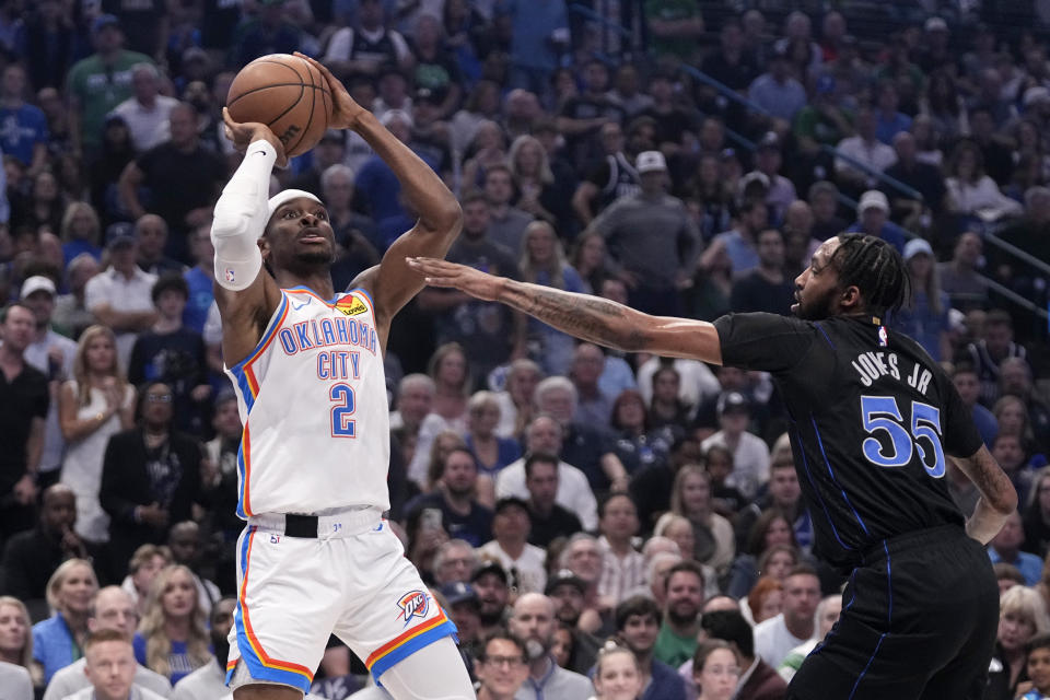 Oklahoma City Thunder guard Shai Gilgeous-Alexander (2) shoots over Dallas Mavericks' Derrick Jones Jr. (55) in the first half of Game 6 of an NBA basketball second-round playoff series Saturday, May 18, 2024, in Dallas. (AP Photo/Tony Gutierrez)