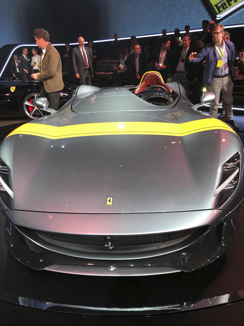 The Ferrari Monza SP1 is displayed in Maranello, Italy, Tuesday, Sept. 18, 2018. Sportscar maker Ferrari has unveiled two updated versions of its classic open-top "barchetta" racing model as it briefs investors on a new five-year business plan. Nicolo Boari, the head of product marketing, said Tuesday that the Ferrari Monza SP1 and SP2 are "the most powerful ever in Ferrari history," with an 810 horsepower engine able to reach 100 kilometers per hour (62 mph) in 2.9 seconds. (AP Photo/Collen Barry)