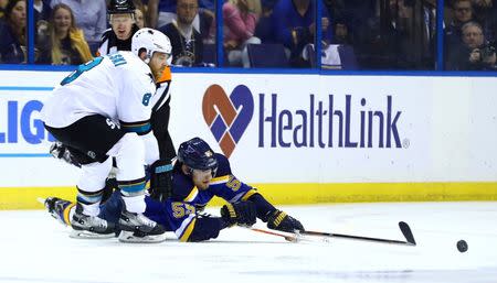 May 23, 2016; St. Louis, MO, USA; San Jose Sharks center Joe Pavelski (8) and St. Louis Blues defenseman Colton Parayko (55) fight for a loose puck in game five of the Western Conference Final of the 2016 Stanley Cup Playoffs at Scottrade Center. Mandatory Credit: Billy Hurst-USA TODAY Sports