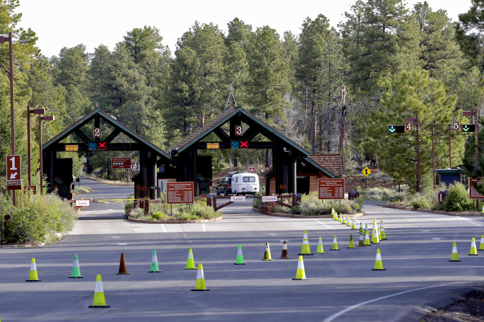 Guests arrive at the Grand Canyon Friday, May 15, 2020, in Grand Canyon, Ariz. Tourists are once again roaming portions of Grand Canyon National Park when it partially reopened Friday morning, despite objections that the action could exacerbate the coronavirus pandemic. (AP Photo/Matt York)