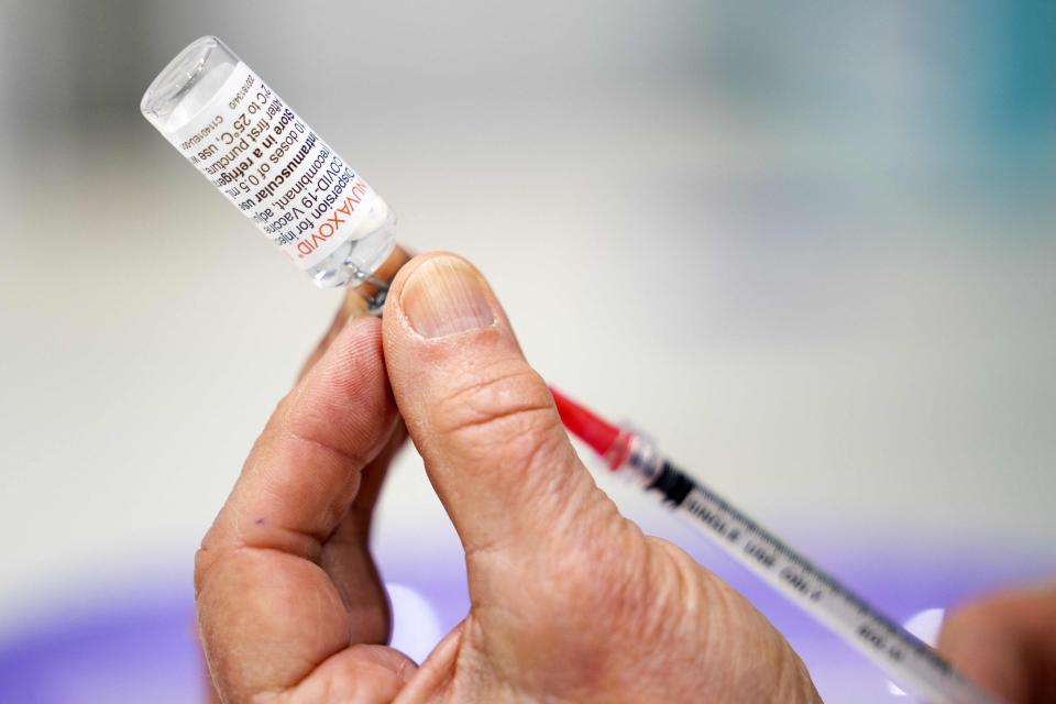 A health care worker prepares a dose of Nuvaxovid vaccine from Novavax in Utrecht, Netherlands, on March 15. Unlike mRNA vaccines, Nuvaxovid does not need to be stored in ultra-low temperatures, giving it a logistical advantage in difficult-to-access regions.