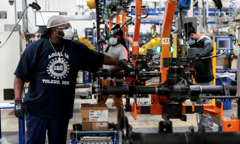 FILE PHOTO: Dana Inc. assembly technicians wear face masks as they assemble axles for automakers, amid the coronavirus (COVID-19) outbreak, in Toledo