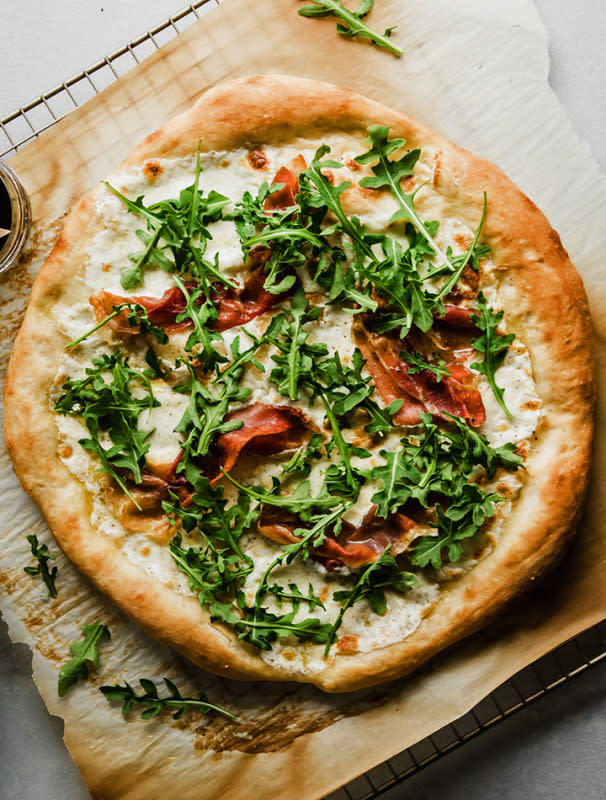 <p>Life As a Strawberry</p><p>This easy prosciutto pizza with arugula uses homemade or store-bought pizza dough, fresh mozzarella and a quick balsamic reduction.</p><p><strong>Get the recipe: <a href="https://www.lifeasastrawberry.com/arugula-prosciutto-pizza/" rel="nofollow noopener" target="_blank" data-ylk="slk:Arugula Prosciutto Pizza;elm:context_link;itc:0;sec:content-canvas" class="link rapid-noclick-resp">Arugula Prosciutto Pizza</a></strong></p>