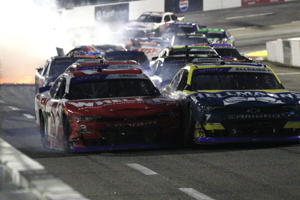 MARTINSVILLE, VA - OCTOBER 28: Justin Allgaier (#7 JR Motorsports Hellmann's Chevrolet) races with Sheldon Creed (#2 Richard Childress Racing Whelen Chevrolet) as Austin Hill (#21 Richard Childress Racing Global Industrial Chevrolet) spins behind them on the final turn during the running of the NASCAR Xfinity Series Playoff Dead-On Tools 250 on October 28, 2023 at Martinsville Speedway in Martinsville, VA. (Photo by Jeff Robinson/Icon Sportswire via Getty Images)