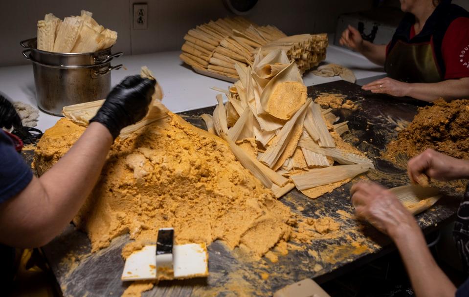 Tamaleria Nuevo Leon employees Erika Ramirez, left, Chayo Rodriguez, center, and Deyla Ramirez prepare dozens of tamales inside the southwest Detroit business on Thursday, March 2, 2023.