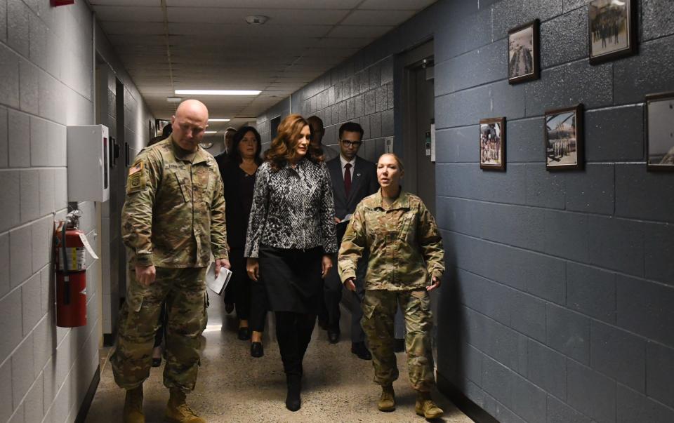 Michigan Gov. Gretchen Whitmer speaks with Michigan National Guard Maj. Tina Corner, right, during a tour and ribbon cutting ceremony Monday, Sept. 26, 2022, at the Michigan Army National Guard Grand Ledge Armory in Grand Ledge, Monday, Sept. 26, 2022. The event highlighted improvements at the armory, including upgraded locker rooms, toilet facilities, and the addition of lactation rooms to better serve Michigan's women soldiers.