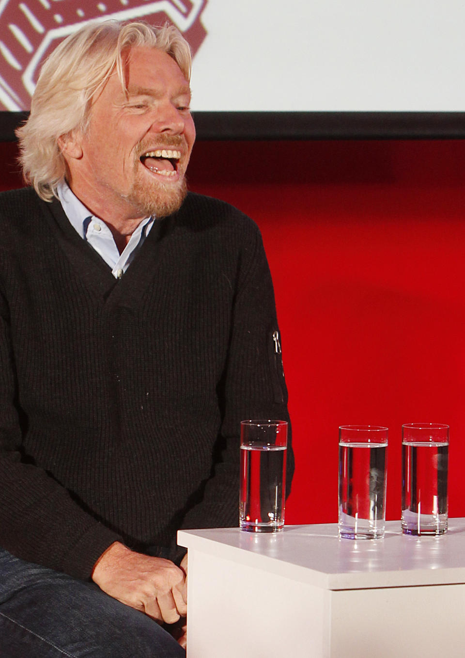Virgin Group owner, British billionaire Richard Branson smiles to students packing a hall at Warsaw University as he tells them that they need to be "passionate about whatever you are doing in life" to achieve success during a launch of Virgin Academy, a project to help young Poles start their businesses in Warsaw, Poland, on Wednesday, Oct. 24, 2012. Branson also said that the launch of his space travel project Virgin Galactic keeps being pushed back. (AP Photo/Czarek Sokolowski)