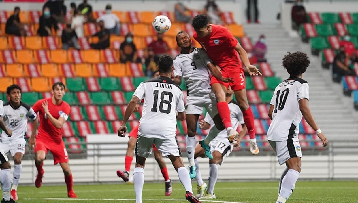 Singapore (red jersey) battling against Timor Lester in their AFC U-23 Asian Cup qualifier. (PHOTO: Football Association of Singapore)