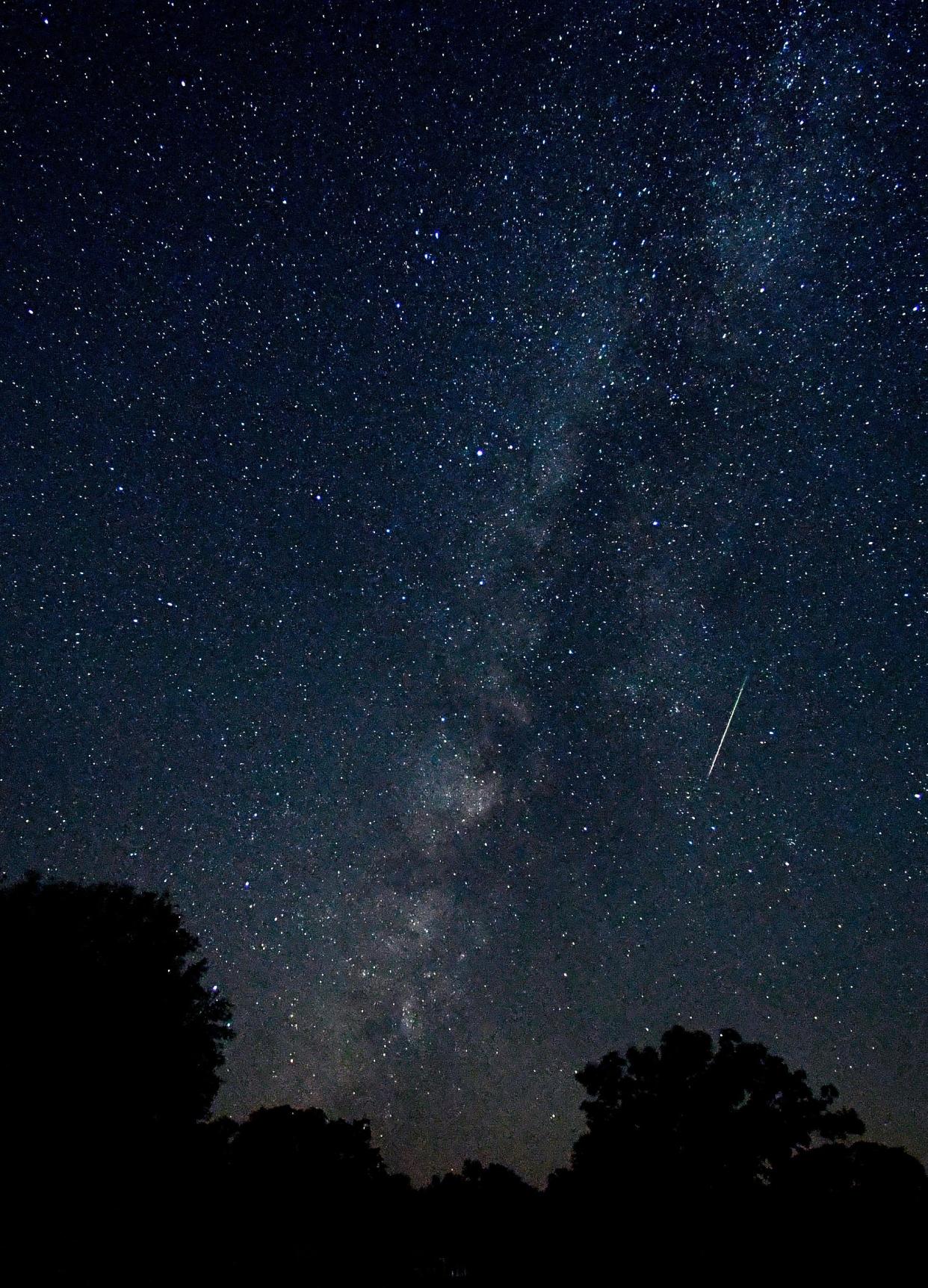 A meteor is caught as a blurred line in this eight-second exposure Aug. 12 of the Milky Way over Abilene State Park.