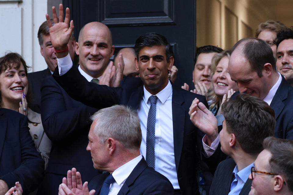 LONDON, ENGLAND - OCTOBER 24: New Conservative Party leader and incoming prime minister Rishi Sunak (C) waves as he is greeted by colleagues at the Conservative Party Headquarters after having been announced as the winner of the Conservative Party leadership contest on October 24, 2022 in London, England. Rishi Sunak was appointed as Conservative leader and the UK's next Prime Minister after he was the only candidate to garner 100-plus votes from Conservative MPs in the contest for the top job. (Photo by Dan Kitwood/Getty Images)