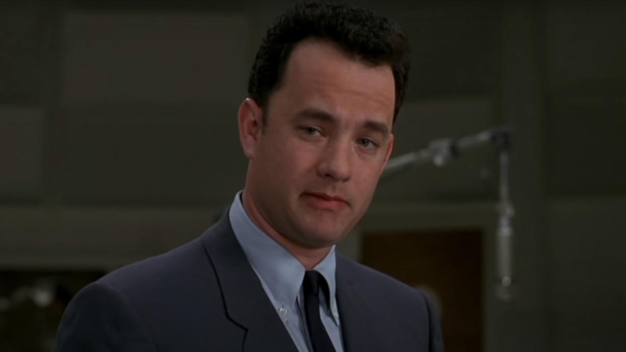  Tom Hanks talks in a recording studio in That Thing You Do. 