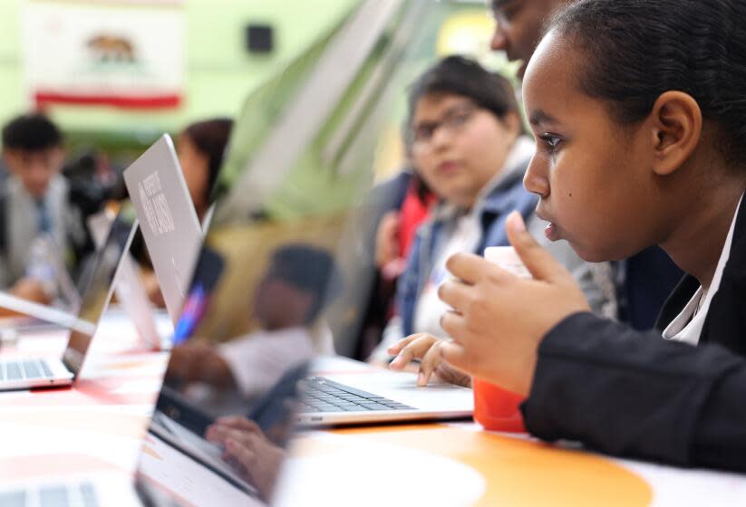 LOS ANGELES-CA-MARCH 20, 2024: Saron Henok, 10, uses Ed, a new district-developed Artificial Intelligence-assisted "learning acceleration web-based platform that will boost student success and revolutionize how K-12 education is tailored to meet individual needs," during the official launch event at Edward R. Roybal Learning Center in Los Angeles on March 20, 2024. (Christina House / Los Angeles Times)