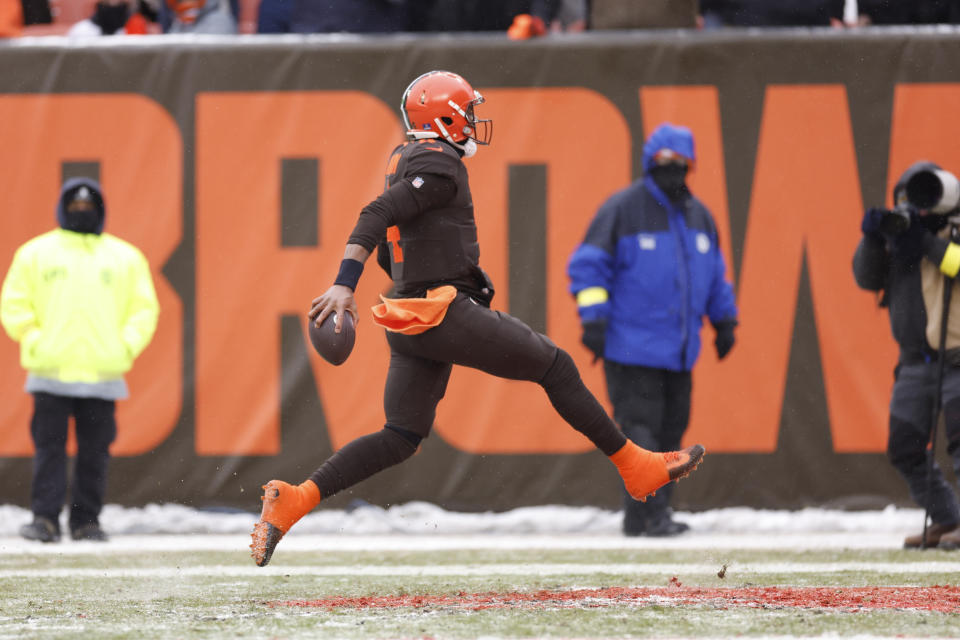 Cleveland Browns quarterback Deshaun Watson (4) runs for a 12-yard rushing touchdown during the first half of an NFL football game against the New Orleans Saints, Saturday, Dec. 24, 2022, in Cleveland. (AP Photo/Ron Schwane)