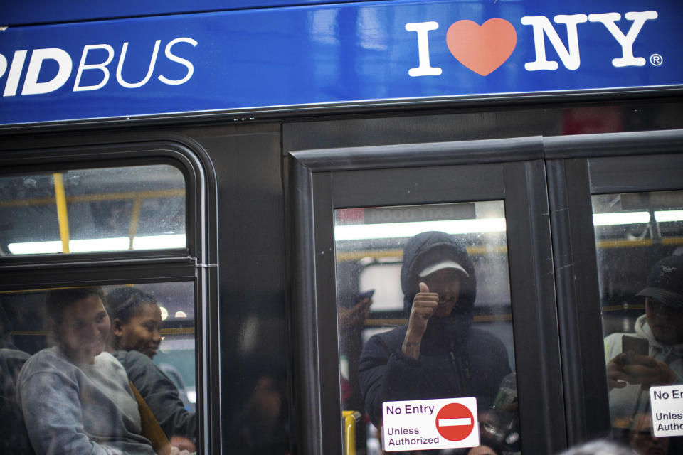 FILE - Asylum seekers arrive at the Roosevelt Hotel on Friday, May 19, 2023, in New York. Three New York City boroughs lost almost 80,000 residents from people moving away last year, according to population estimates released Thursday, March 14, 2024, but city officials think those numbers are a major undercount that didn't capture the influx of asylum seekers who came to the city.(AP Photo/Eduardo Munoz Alvarez)